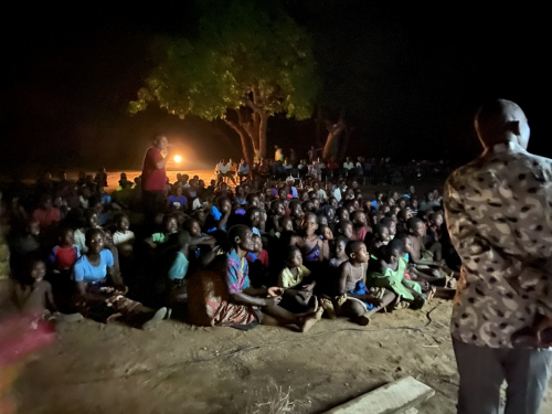 The Jesus Film App projected onto a large screen for community-wide outreach evenings